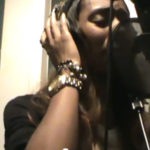 Photo of Latanfernee Hardaway singing in the studio booth