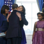 Photo of Barack Obama hugging daughter Malia during 2013 Oath of Office