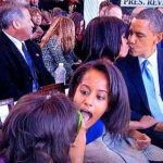 Photo of Sasha and Malia during Michelle, Barack Obama kissing picture